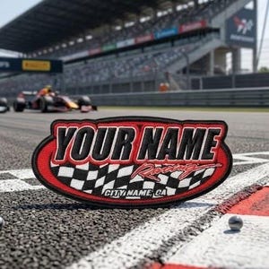May include: Oval-shaped racing patch with the text "YOUR NAME Racing" in black and red. The patch features a checkered flag design and the text "CITY NAME, CA". The patch is on a race track with race cars in the background.