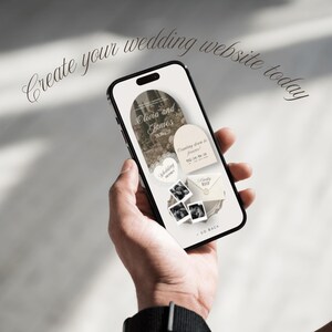 May include: A black smartphone displaying a wedding website interface with the text Create your wedding website today. The screen features an arched photo frame, the names Olivia and James, a countdown timer, wedding details, and RSVP envelope.