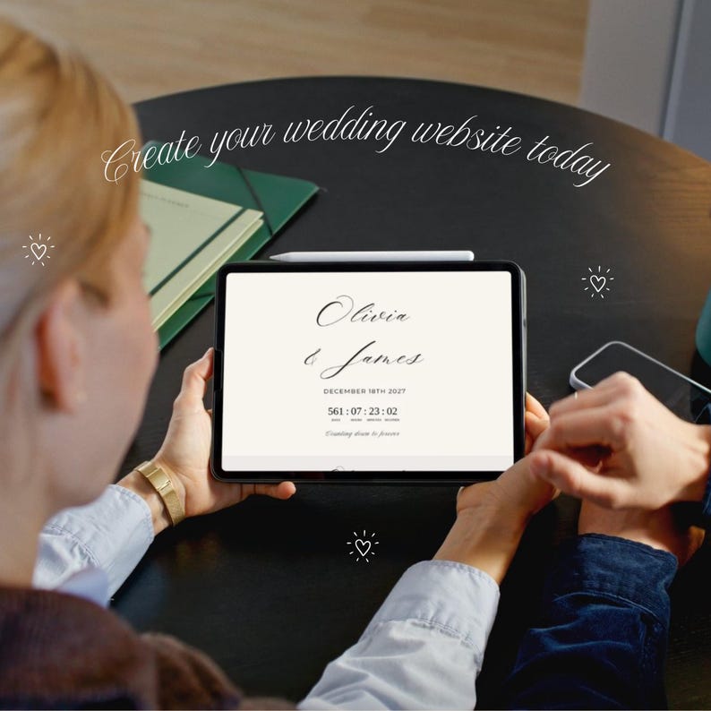 May include: A tablet displaying a wedding website with the text Olivia & James, December 18th 2027, and a countdown timer. The screen features a cream background with black serif and script typography. A white stylus rests on the top edge.