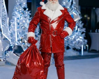 May include: A Santa Claus costume featuring a glossy red vinyl jacket with a white faux fur collar, matching red vinyl pants, red gloves, and a red hat with white trim. A large, matching red vinyl sack is held in one hand, completing the ensemble.