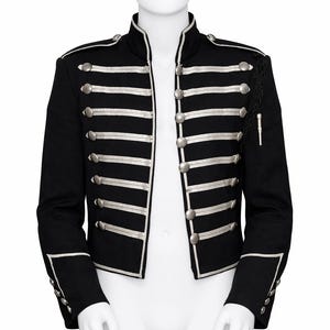 May include: Black military-style jacket with silver trim and buttons. The jacket features multiple horizontal silver stripes across the chest and sleeves, with silver trim along the collar and cuffs. A decorative tassel hangs from the shoulder.