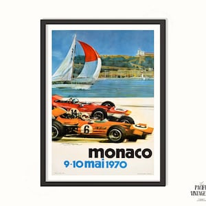 May include: Vintage Monaco Grand Prix poster featuring two race cars in orange and red, with a sailboat in the background. The poster has the text "Monaco" and "9-10 mai 1970" in blue and white.