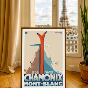 May include: Framed vintage travel poster for Chamonix Mont-Blanc, featuring a mountain scene with skiers and climbers. The poster has a retro design with orange and blue accents. The dimensions are 30 x 40 inches.