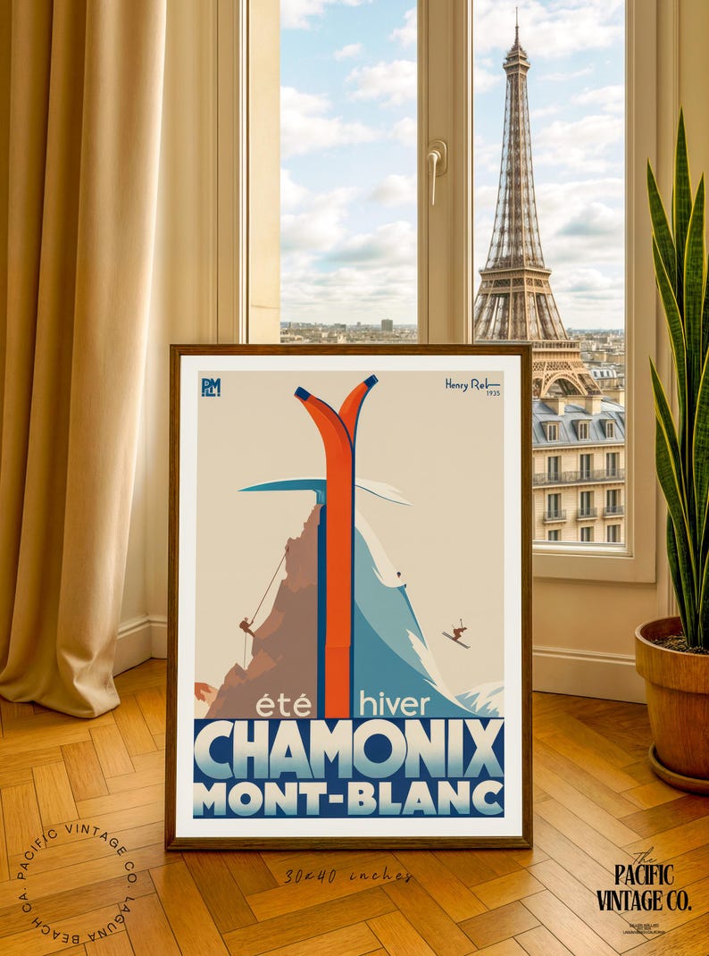 May include: Framed vintage travel poster for Chamonix Mont-Blanc, featuring a mountain scene with skiers and climbers. The poster has a retro design with orange and blue accents. The dimensions are 30 x 40 inches.