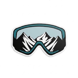 May include: A sticker featuring a stylized illustration of ski goggles with a mountain range visible through the lenses. The goggles have a teal frame and black accents, with white peaks in the background.