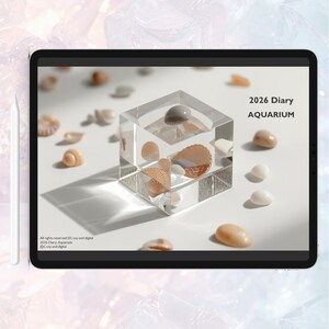 May include: A digital illustration of a clear cube containing seashells, with scattered shells around it. The text "2026 Diary AQUARIUM" is displayed on the screen. The image is on a tablet with a stylus.