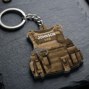 May include: A set of three ceramic mugs with a speckled, matte finish. The mugs are in shades of cream, light gray, and dark gray. Each mug has a simple, minimalist design and a rounded handle.