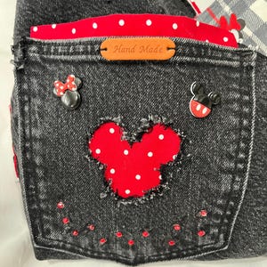 mickey cut out fringe front pocket with mickey and minnie decor with red rhinestones