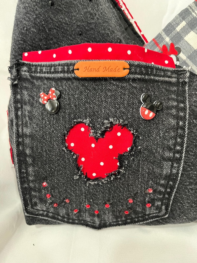 mickey cut out fringe front pocket with mickey and minnie decor with red rhinestones