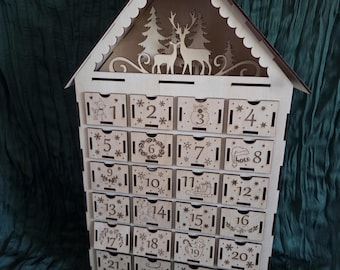 May include: Wooden Christmas advent calendar shaped like a house. It has 24 small drawers, each numbered and decorated with festive images. The top section features a cut-out design of deer and trees.