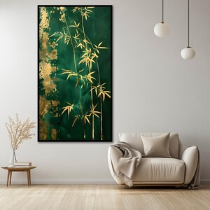 May include: A framed vertical canvas art piece featuring a gold bamboo design against a dark green background with gold accents. The artwork is displayed in a modern living room setting with a neutral-toned sofa and wooden floor.