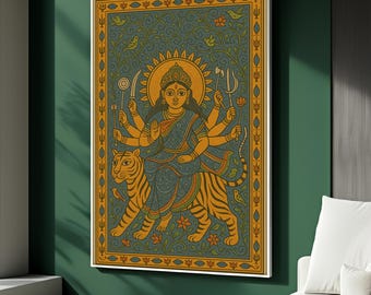 May include: A framed art print featuring a detailed illustration of a deity riding a tiger. The artwork showcases a woman with multiple arms, adorned in blue and gold, set against a teal background with floral and bird motifs. The tiger is orange and black.