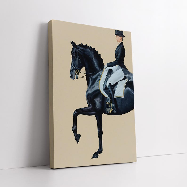May include: A canvas print depicts a black horse in a dressage pose, ridden by a person in formal attire. The rider wears a black coat and top hat. The horse's tack includes a bridle and reins. The background is a solid beige color.
