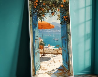 May include: A framed art print of a coastal scene. The artwork features an orange parasol, a table, and chairs on a patio, framed by blue doors and orange trees. Sailboats are on the turquoise water under a bright sky, evoking a Mediterranean feel.