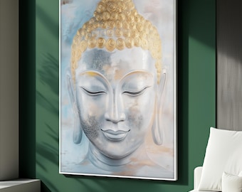 May include: A framed wall art piece featuring a serene Buddha head. The artwork showcases a white face with closed eyes and a gentle smile, contrasted by a golden, textured hairpiece. The background has soft blue and beige hues.