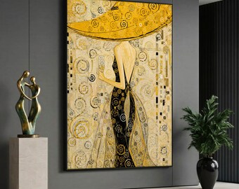 May include: A large rectangular wall art print featuring a stylized figure in a black dress with a wide yellow hat, holding a glass. The background is a textured gold pattern with circular motifs and geometric shapes in a vertical orientation.
