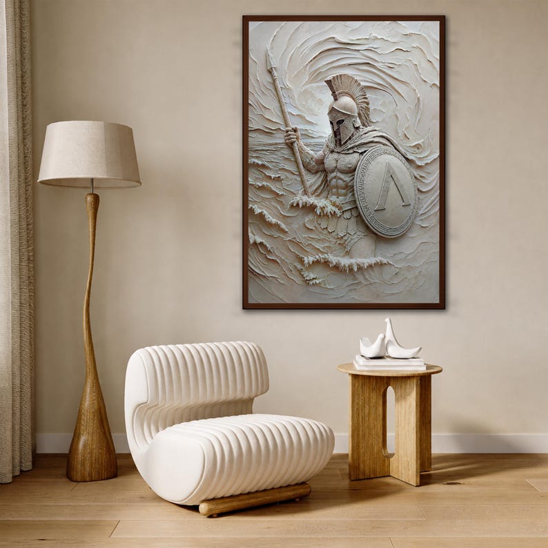 May include: A framed wall art piece featuring a textured, off-white relief sculpture of a Spartan warrior in a helmet, holding a spear and a circular shield with a lambda symbol, depicted emerging from stylized, swirling waves of water.