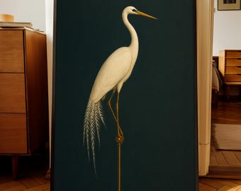 May include: A framed print of a white egret with a long, curved neck and yellow beak, standing on a thin, gold-coloured rod. The bird has detailed feathering against a dark teal background. The frame is black.