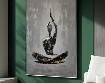 May include: Abstract painting of a figure in a yoga pose. The figure is black with gold accents, set against a gray background. The artwork is framed in a white border and hangs on a green wall.