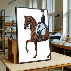 May include: A framed equestrian art print. The artwork depicts a brown horse in a dressage pose with a rider in formal attire. The rider wears a black jacket, top hat, and white breeches. The horse is in mid-stride, with one leg raised.
