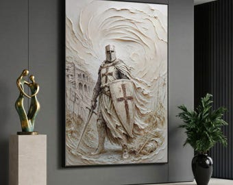 May include: A rectangular wall art print featuring a textured, off-white depiction of a medieval knight in armor. The knight holds a sword and a shield, both marked with a cross, standing before a swirling, abstract background of stone structures.