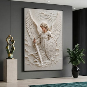 May include: A rectangular wall art piece featuring a relief sculpture of an angel with large wings, wearing armour, holding a sword, and carrying a shield inscribed with the Latin text 'QUIS UT DEUS' set against a swirling, cloud-like background.