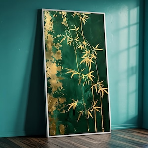 May include: A framed artwork featuring a green and gold abstract bamboo design. The painting has a dark green background with gold leaf accents and gold bamboo stalks and leaves. The artwork is displayed in a white frame.