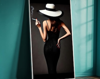 May include: A framed art print featuring a woman in a black dress and a wide-brimmed hat, holding a cigarette. The hat is white with a black band. The woman's red nail polish contrasts with the dark dress. The artwork is displayed against a gray background.