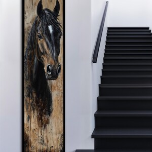 May include: Vertical framed artwork depicting a horse's head. The horse has a dark brown coat and a white marking on its forehead. The background has a textured, neutral colour palette with dark accents.