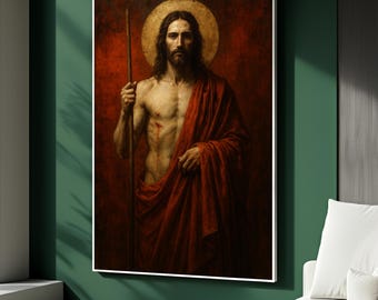 May include: A framed painting depicts a man with long hair, a beard, and a golden halo. He holds a staff and wears a red robe. The background is a deep red, creating a dramatic contrast.