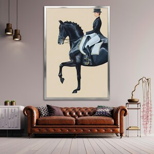 May include: Framed equestrian art print featuring a black horse in a dressage pose with a rider in formal attire. The artwork is set against a neutral background and framed in silver. The overall theme is equestrian and classic.