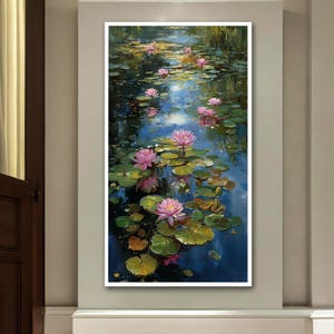 May include: A vertical painting of a pond with pink water lilies and green lily pads. The water reflects the sky, creating a blue and white shimmering effect. The artwork is framed in a white border.