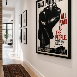 Black Panther Party style poster featuring raised fist and activist design
