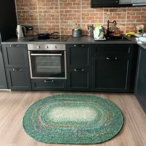 Wool Rug in green shades, oval shape 38&#39;&#39; by 52&#39;&#39;