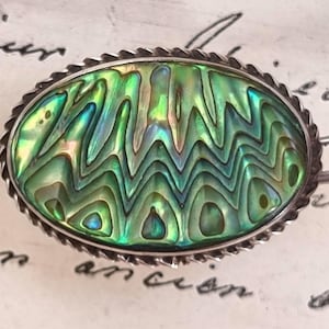 Spilla vintage in conchiglia di abalone Paua e argento sterling, Ataahua, anni '30, Nuova Zelanda, firmata.