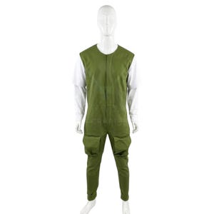 May include: A green jumpsuit with two front pockets and a white long-sleeved shirt underneath. The jumpsuit has a sleeveless design and a button-up front. The mannequin is standing against a white background.