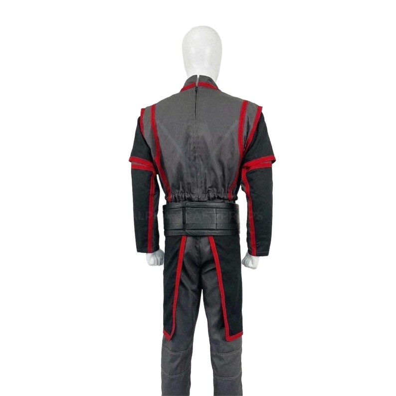 May include: A gray and black costume with red trim, displayed on a mannequin. The outfit includes a jacket with red accents, black sleeves, and matching pants. A black belt cinches the waist. The costume is designed for cosplay or themed events.