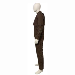 May include: A brown, two-piece outfit displayed on a mannequin. The outfit includes a long-sleeved jacket with a unique shoulder design and matching pants. The fabric has a subtle vertical texture.