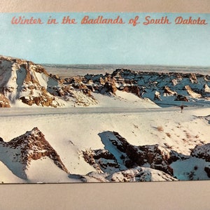 Winter comes to to Bad Lands National, South Dakota - Vintage Postcard