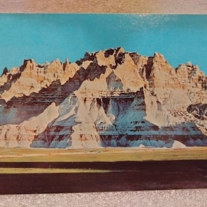 Winter comes to to Bad Lands National, South Dakota - Vintage Postcard