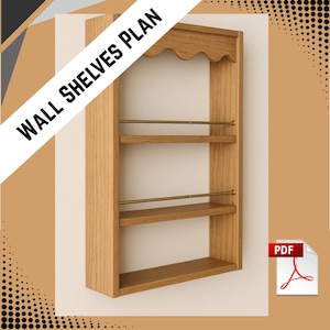 Puede incluir: Plan de estantería de pared de madera con tres estantes y barras de latón. La parte superior del estante tiene un borde festoneado decorativo. El texto "WALL SHELVES PLAN" está impreso en la imagen. Un icono PDF está en la esquina inferior derecha.
