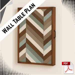 Könnte beinhalten: Ein Wandtischplan aus Holz mit einem Fischgrätmuster in Braun-, Beige- und Blaugrüntönen. Der Tisch hat einen dunkelbraunen Rahmen und einen schwarzen Griff. Der Text "WALL TABLE PLAN" wird diagonal oben angezeigt.