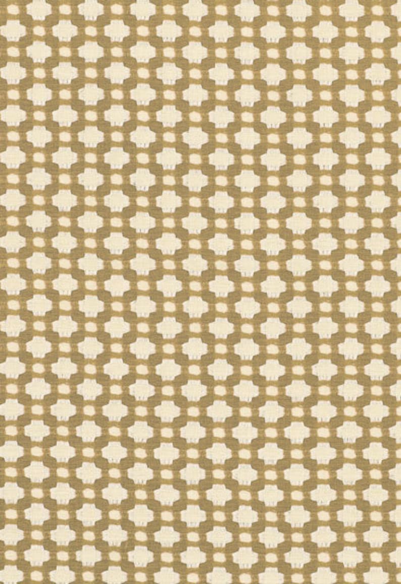 May include: A seamless pattern of small white squares on a brown background. The squares are arranged in a grid pattern, creating a subtle geometric design.