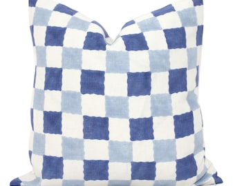 May include: A blue and white checkered throw pillow with a soft, textured fabric.