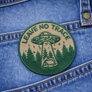 May include: A set of three ceramic mugs with a speckled, matte finish. The mugs are in shades of cream, light gray, and dark gray. Each mug has a simple, minimalist design, perfect for coffee or tea.