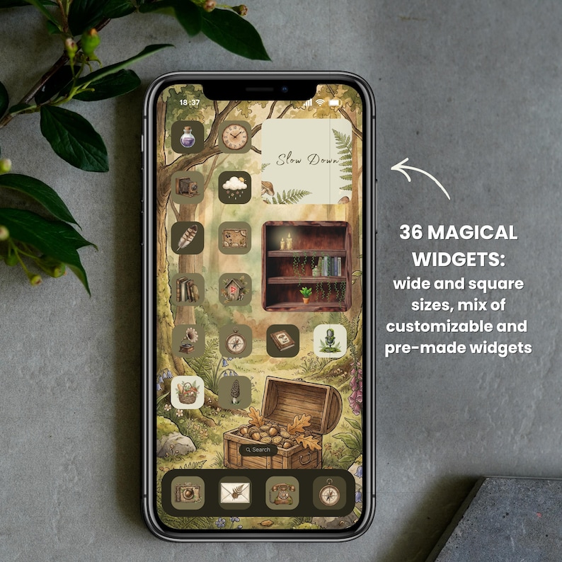 May include: A smartphone displaying a forest-themed digital interface with earthy green and brown icons, a wooden bookshelf widget, a treasure chest graphic, and a square widget featuring the text Slow Down, alongside 36 magical widgets text.