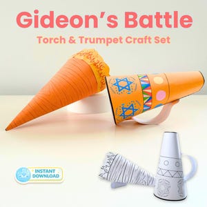 May include: A Gideon's Battle Torch & Trumpet craft set featuring a paper torch with orange wood grain and flame patterns, and a trumpet with blue Star of David symbols and colourful geometric bands, alongside black and white colouring templates.