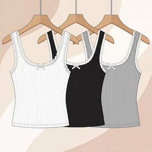 May include: Three ribbed vest tops in white, black, and grey, each hanging on a wooden hanger. The sleeveless tops feature a scoop neckline with white lace trim and a small white bow detail at the centre of the chest, creating a simple design.