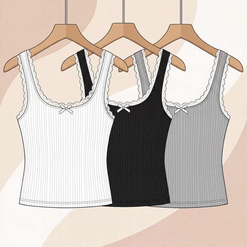 May include: Three ribbed vest tops in white, black, and grey, each hanging on a wooden hanger. The sleeveless tops feature a scoop neckline with white lace trim and a small white bow detail at the centre of the chest, creating a simple design.