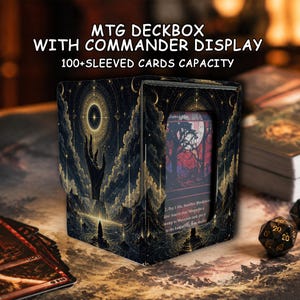 May include: A black and gold MTG deckbox with a commander display window and a 100+ sleeved cards capacity. The exterior features a celestial illustration of a hand reaching toward a glowing star above a dark landscape with mountains and water.